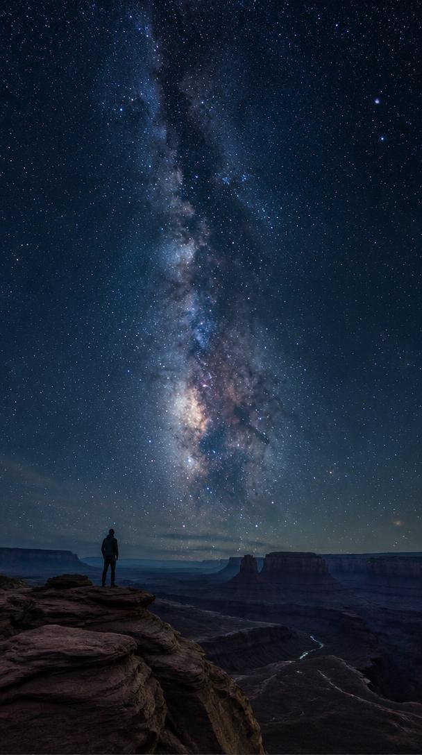 Milky Way over a desert canyon wallpaper